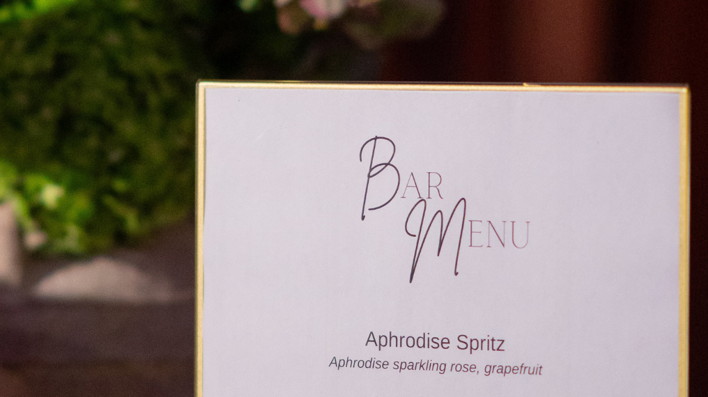Close up image of a bar menu featuring "Aphrodise Spritz"
